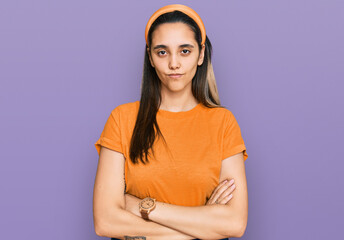 Obraz premium Young hispanic woman wearing casual clothes skeptic and nervous, disapproving expression on face with crossed arms. negative person.