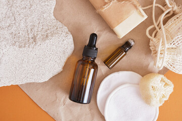 Set of natural organic SPA products amber bottle oil, homemade soap, reusable cotton eco-friendly facial sponges and glass cosmetic container with roll-on