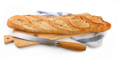 Sourdough baguette and knife on cutting board isolated on white background, closeup. Organic bread with type 1 flour.