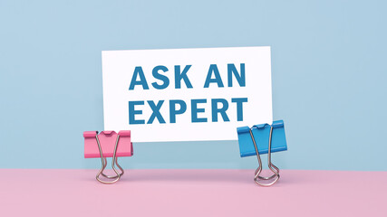 ask an expert - concept of text on business card. Business card on pink and blue background