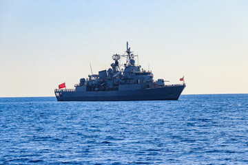 Fototapeta na wymiar Turkish navy warship sailing in the Mediterranean sea. Protection of water borders of Turkey