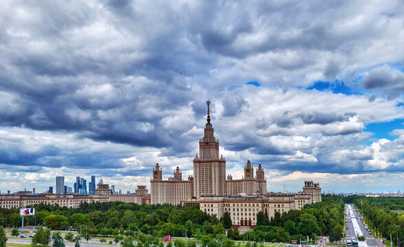 Aerial panoramic view of sunset  campus buildings of famous Moscow university under dramatic cloudy sky in spring