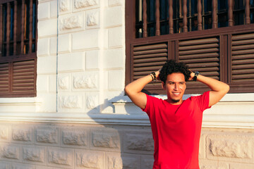 Portrait of a smiling young man in the street