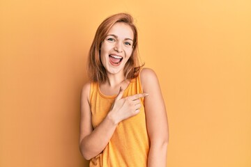 Young caucasian woman wearing casual style with sleeveless shirt cheerful with a smile of face...