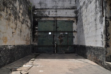 Gate of an abandoned prison in a fort in Ghana.