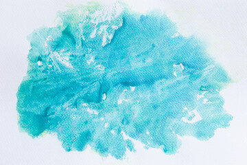 Green watercolor stains on white paper, abstract background.