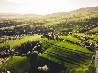 Spring landscape in Slovakia. Polana region, Hrinova. Green spring rural hills landscape, fields, flowering trees, organic farming © Zedspider