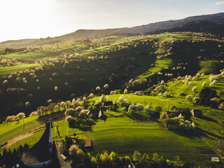 Spring landscape in Slovakia. Polana region, Hrinova. Green spring rural hills landscape, fields, flowering trees, organic farming © Zedspider
