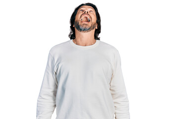 Middle age caucasian man wearing casual clothes angry and mad screaming frustrated and furious,...