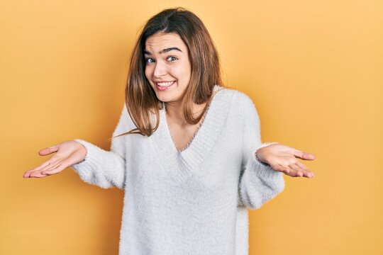 Young caucasian girl wearing casual clothes clueless and confused expression with arms and hands raised. doubt concept.