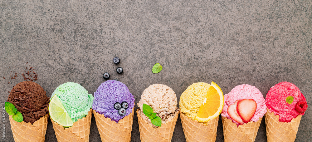 Poster flat lay ice cream cones collection on dark stone background . blank crispy ice cream cone with copy