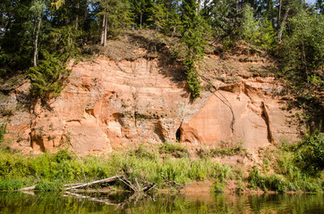 Boat trip down the river Salaca. Beautiful sand stone cliffs, Latvia. 