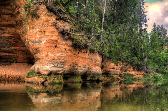 Boat trip down the river Salaca. Beautiful sand stone cliffs, Latvia. 