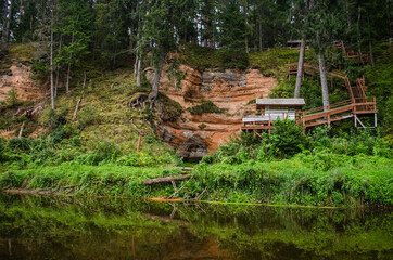 Boat trip down the river Salaca. Beautiful sand stone cliffs, Latvia. 