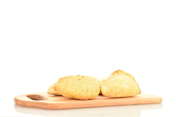Several delicious pies with cherries on a wooden board, close-up, isolated on white.