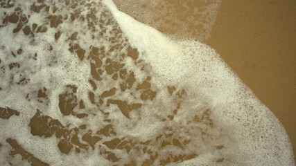 sand of the Caribbean beach, sand close-up against the background of the sea and the ocean, clean fine hot beach sand blown by the sea wind, no people, weather for tourists, place to stay