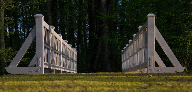 White bridge railings. Maple flowers on the park track....