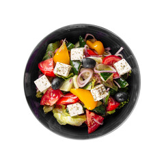 Isolated bowl of fresh greek salad on white background