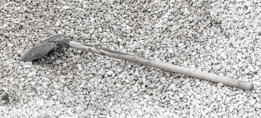 The shovel lies on the rubble.