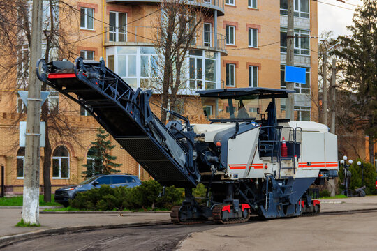 Asphalt Milling And Grinding Machine At Road Repair Site