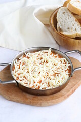 Tomato and peppered egg with cheddar on grated wooden background