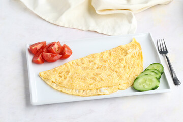 Omelette on wooden background. Local name omlet
