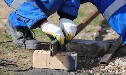 A worker works with metal.