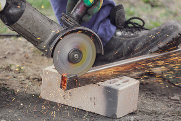 Sparks from metal cutting at a construction site. Technologies