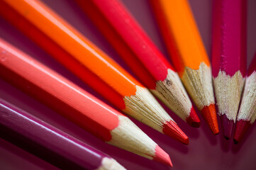 colored pencils  in red and orange