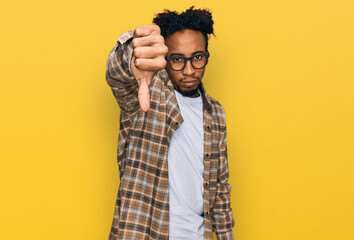 Young african american man with beard wearing casual clothes and glasses looking unhappy and angry showing rejection and negative with thumbs down gesture. bad expression.