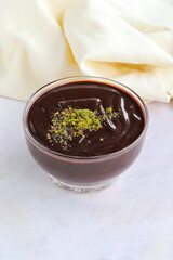 chocolate pudding on wooden background. Local name Supangle