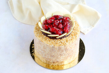 Raspberry birthday cake on wooden background
