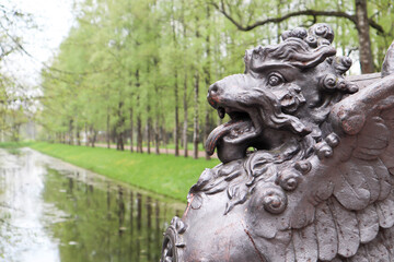 lion statue on the bridge in the park springtime