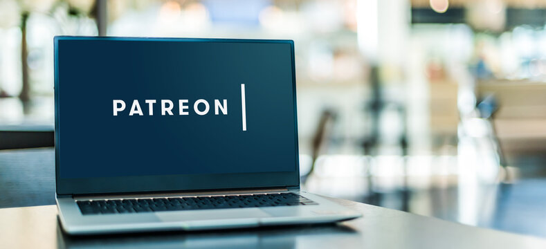 Laptop computer displaying logo of Patreon
