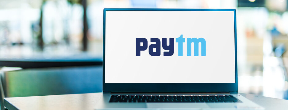 Laptop computer displaying logo of Paytm