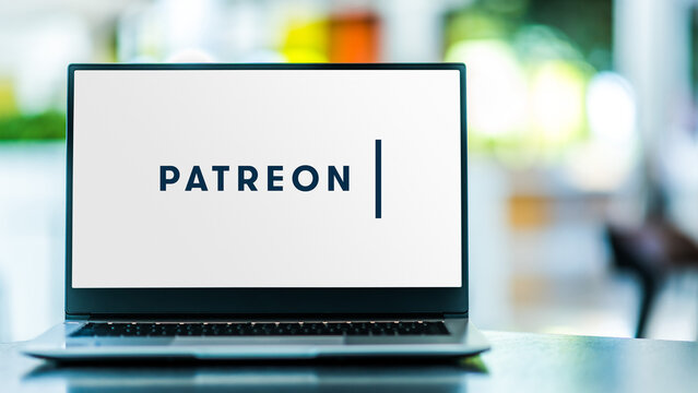 Laptop computer displaying logo of Patreon