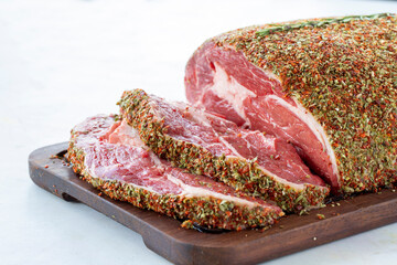 spicy fresh beef ribeye on white wooden background. Close up meat