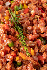raw sauced diced meat on white wood background. Meat background. Meat close-up. Local name dana tantuni