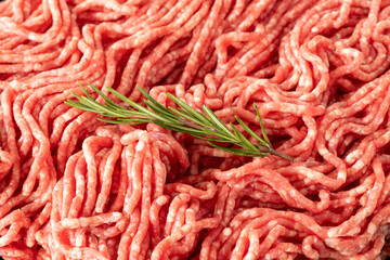 Raw Ground beef on white wooden background. Minced Meat background. Meat close-up