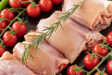 Raw boneless chicken thigh on a white wooden background. Chicken Meat background. Meat close-up