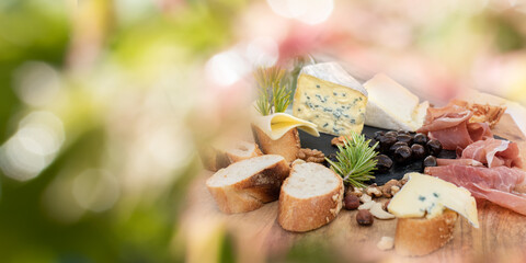 Plate with tasty starters in summer. Atmospheric food photography with short deep of field and...