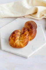 Potato pastry on a white wooden background. Local name patatesli açma
