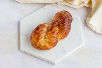 Potato pastry on a white wooden background. Local name patatesli açma
