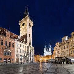 Fototapeta na wymiar The old town square of Prague, Czech Republic, during dusk without people surrounded by the historical, gothic style buildings and the famous Tyn Church. Stroll around Prague's old town Romantic night