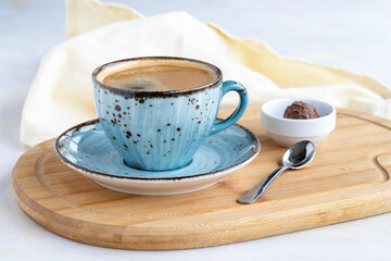A cup of coffee on a white wooden background. Local name filtre kahve