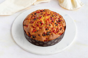 Fruit cake on a white wooden background