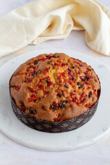 Fruit cake on a white wooden background