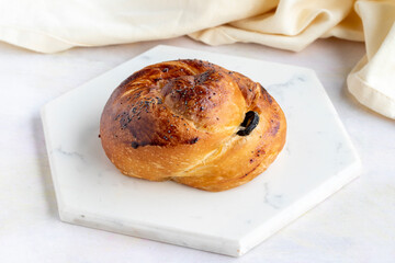 Pastry with olives on a white wooden background. Local name zeytinli açma