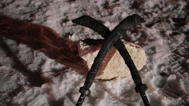 Crossed swords. Black weapons for combat lie on the snow in a crossed form. Ready to be set on fire, so that it burn and fights