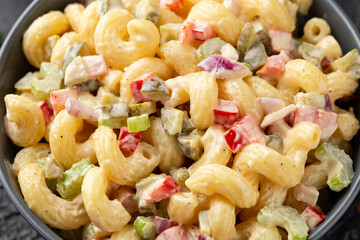 Macaroni Salad with red bell pepper, onion, celery, gherkins and mayonnaise dressing